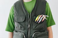 Person Wearing Black Multi Pocket Vest