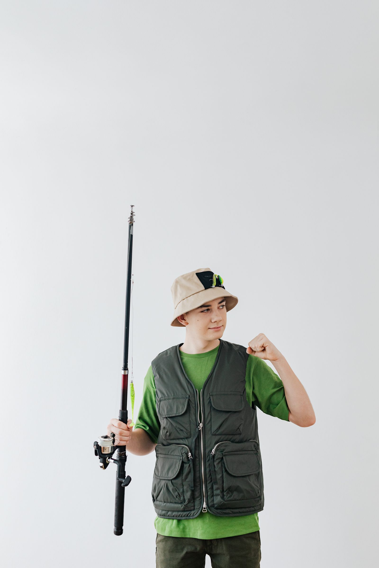 Young angler holding his fishing rod on a family charter