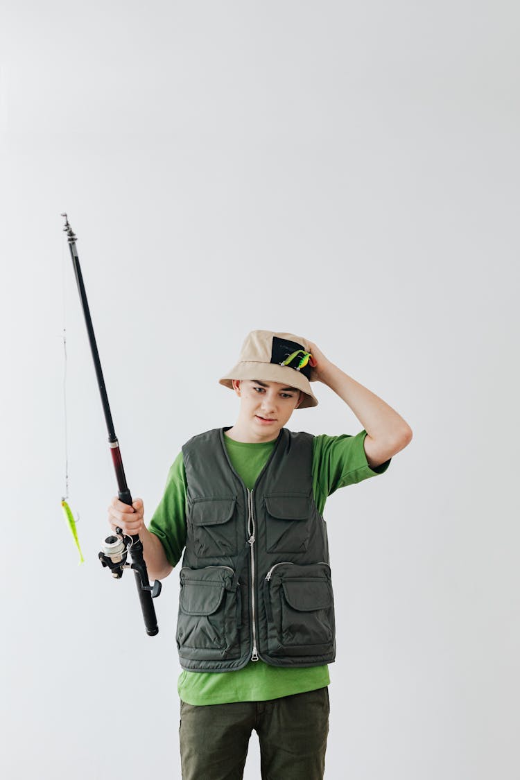 Boy Holding A Fishing Rod