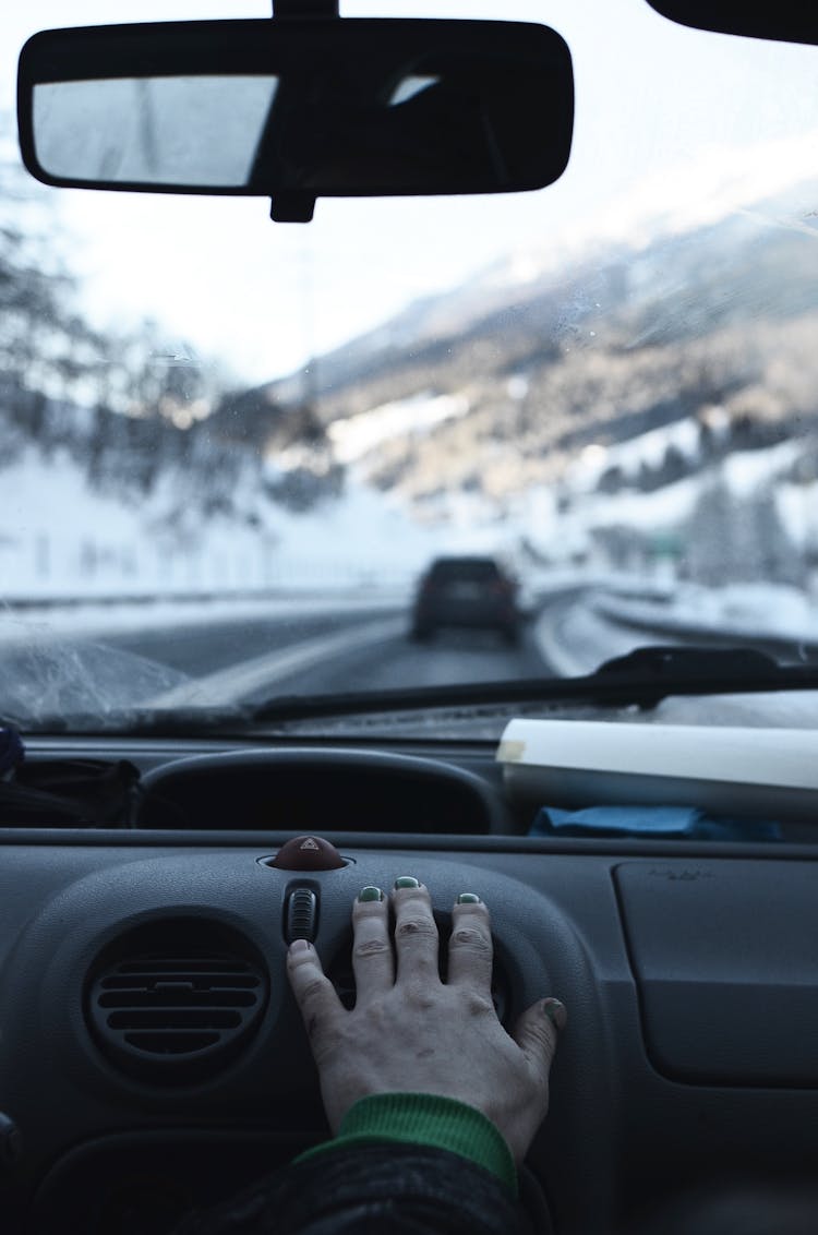 Hand Resting On The Car Air Conditioner