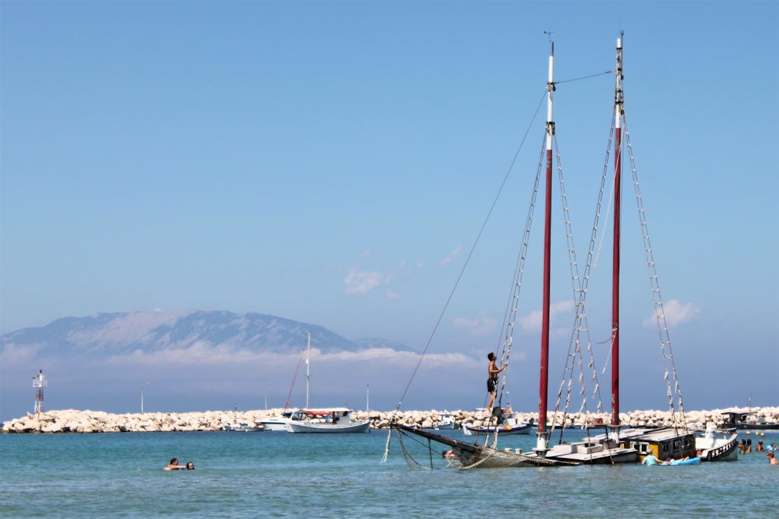 White Sail Boat on Sea