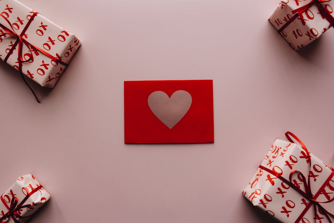 Four Gifts and a Card on the Table