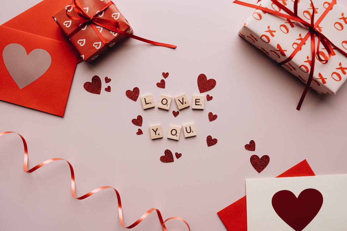 Free Love You Text and Gifts on the Table Stock Photo