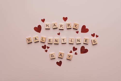 Free Happy Valentine's Day Text On Pink Surface Stock Photo
