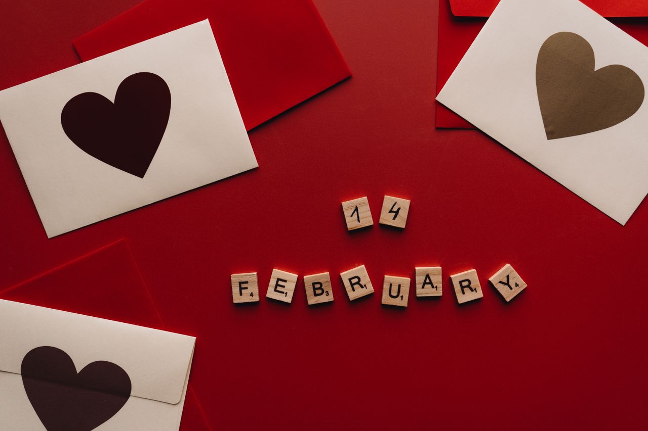 heart themed valentine s day cards and scrabble tiles spelling februar