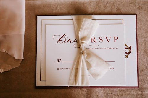 Invitation card with the inscription tied with ribbon