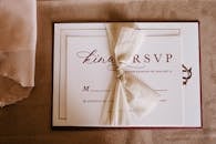 Invitation card with the inscription tied with ribbon