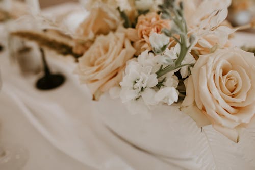 Bunch of delicate flowers on table on wedding day