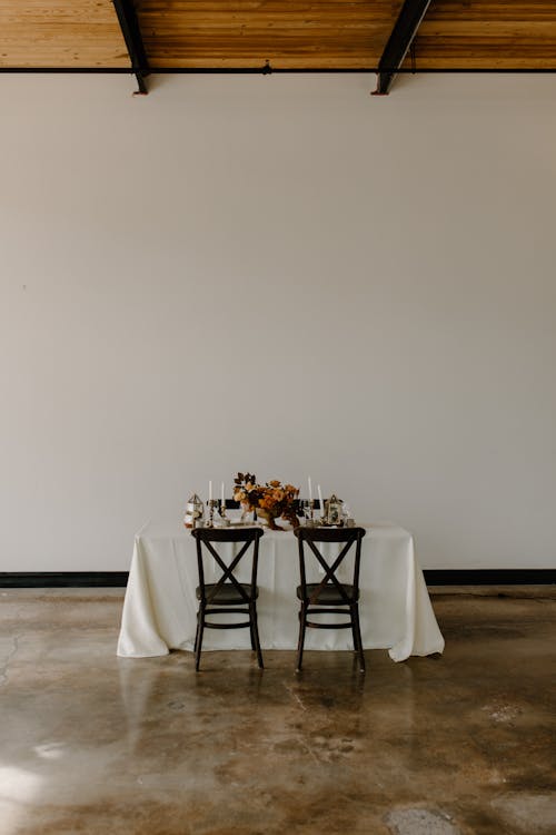 Served table with elegant floral composition during festive dinner