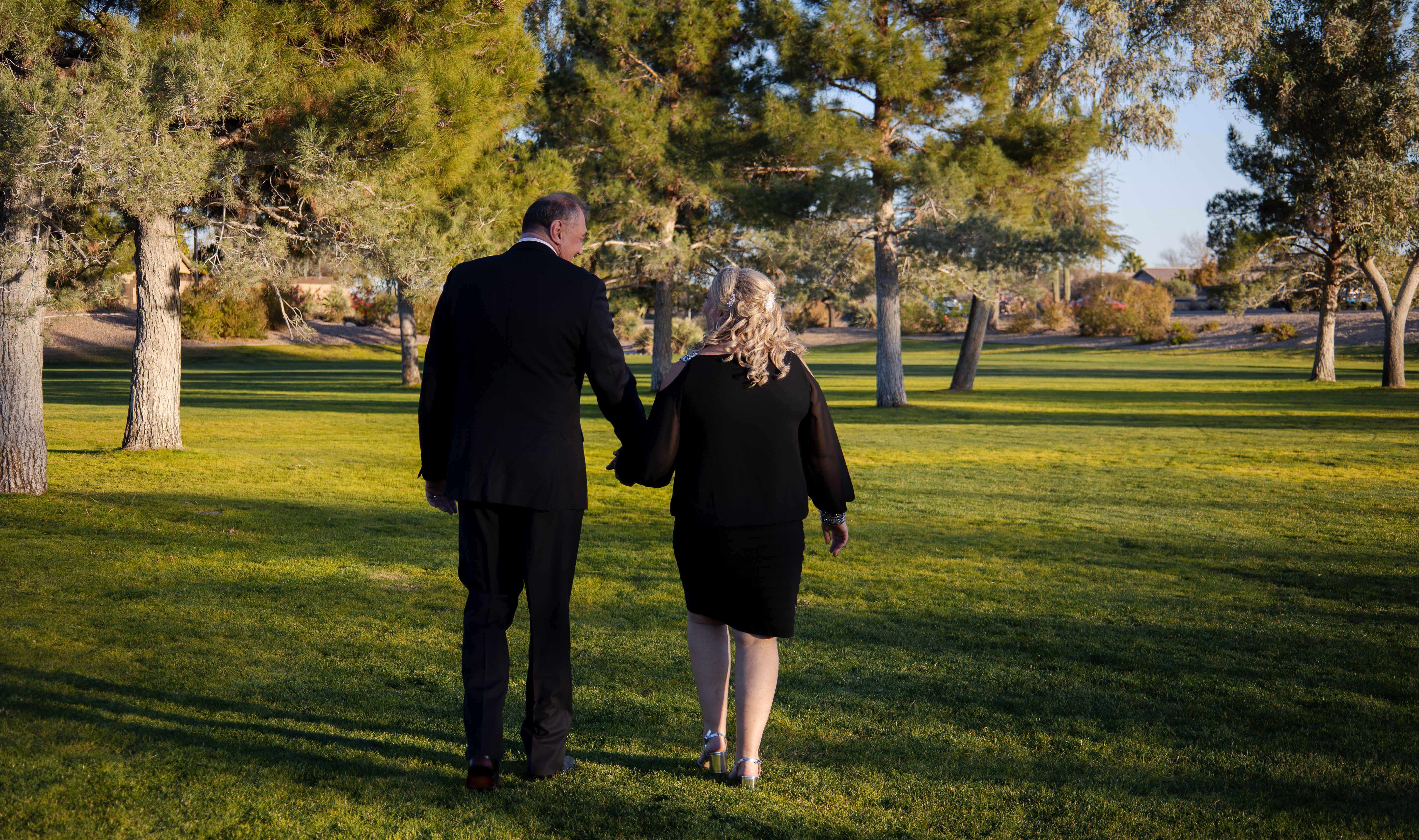 Man and Woman Standing on Green Grass Field · Free Stock Photo