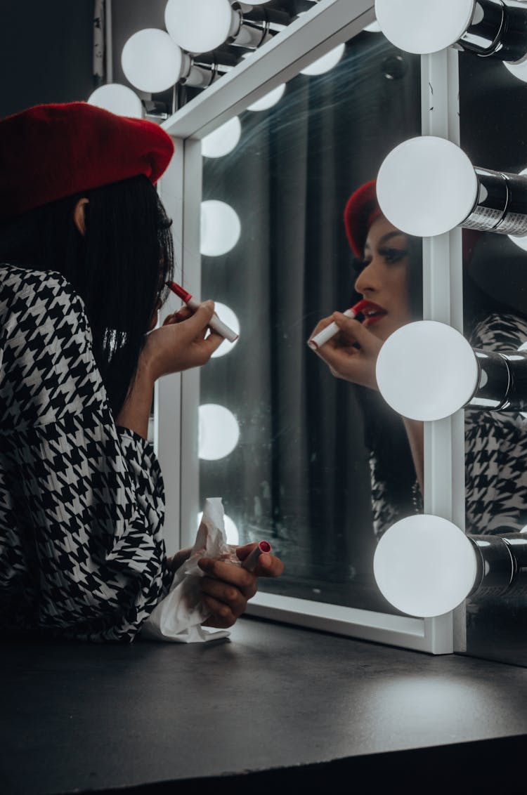 A Woman Applying Lipstick 