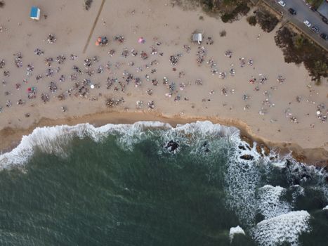 A stunning aerial coastline view of a busy beach in Manantiales, Uruguay.