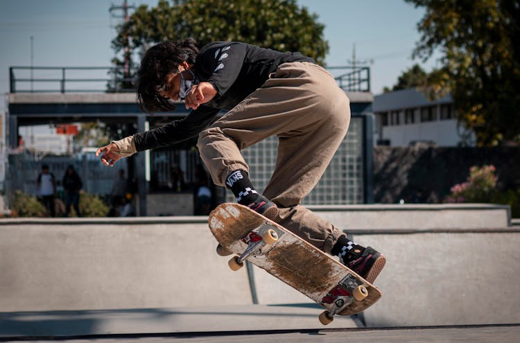 Skater Wearing A Face Mask Doing A Trick