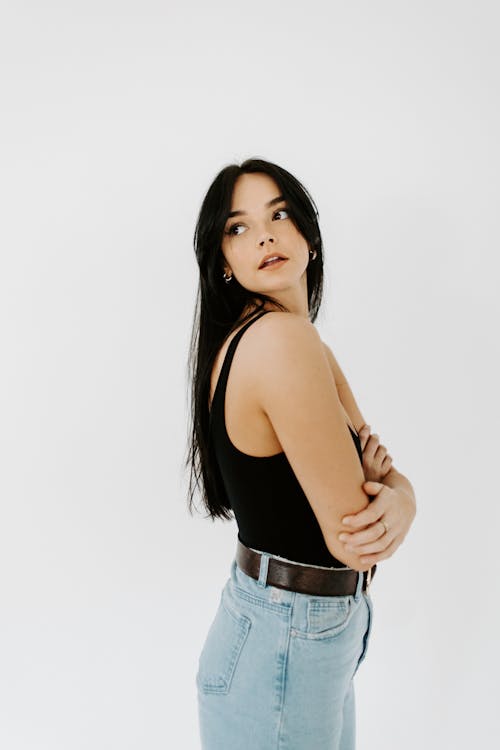 Woman in Black Tank Top and Blue Denim Shorts