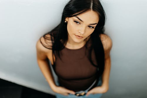 A Woman in Brown Tank Top