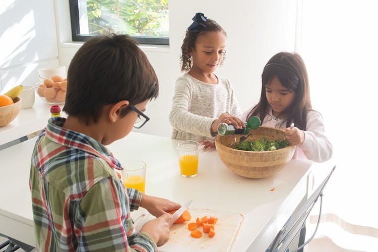 Children Preparing Food In The Kitchen