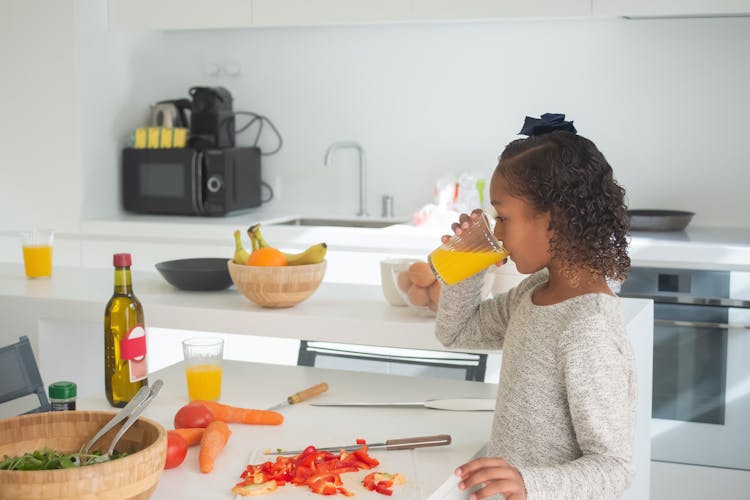 Girl Drinking Orange Juice