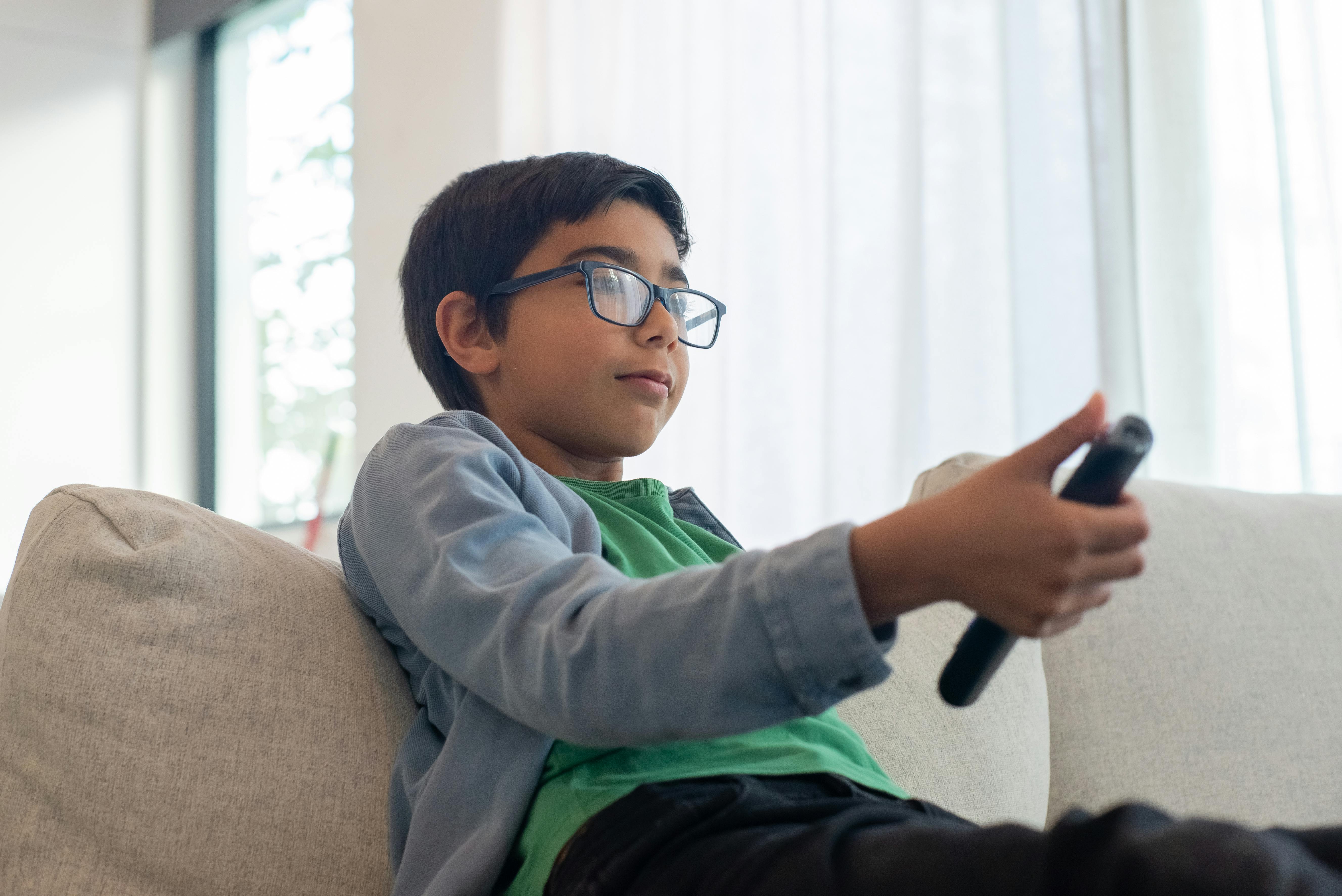 boy holding the remote