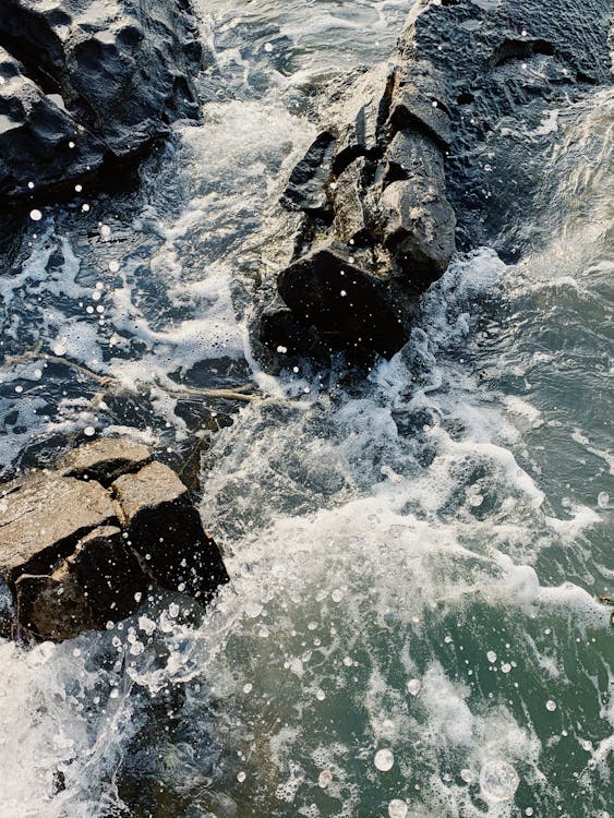 Free Waves Crashing on Rocks Stock Photo