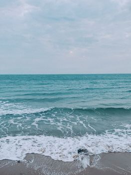 Peaceful waves and sandy beach at Phu Quoc, Vietnam. Perfect for relaxation and nature lovers.