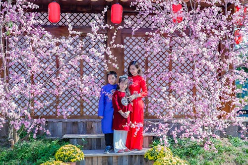 Free Mother with Children Wearing Traditional Asian Clothing Stock Photo