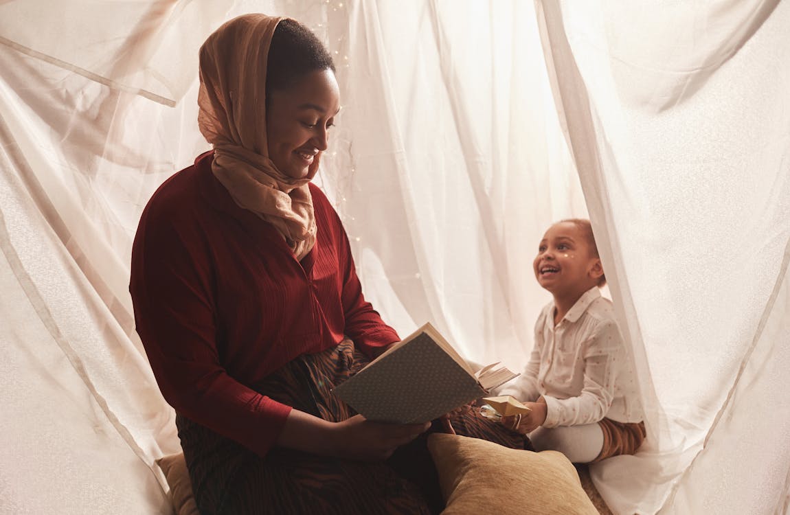 Mother and Daughter Inside the Tent