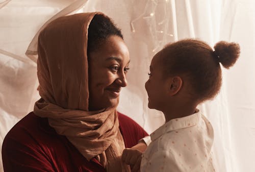 Woman Holding Her Child