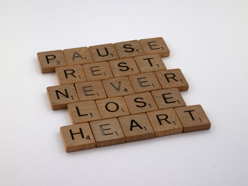 Free Close-up of Various Words Spelled out in Scrabble Tiles Stock Photo