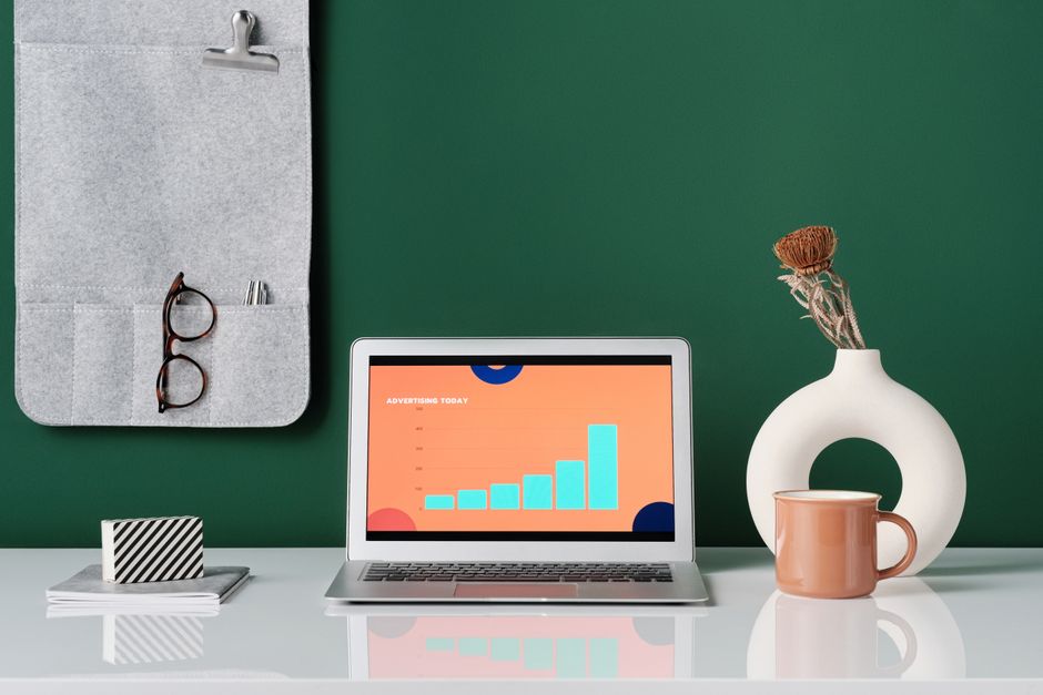 How YNAB Envelope Method Solves Couples’ Budgeting with Separate Accounts Trendy office desk setup featuring a laptop, stylish decor, and modern elements.