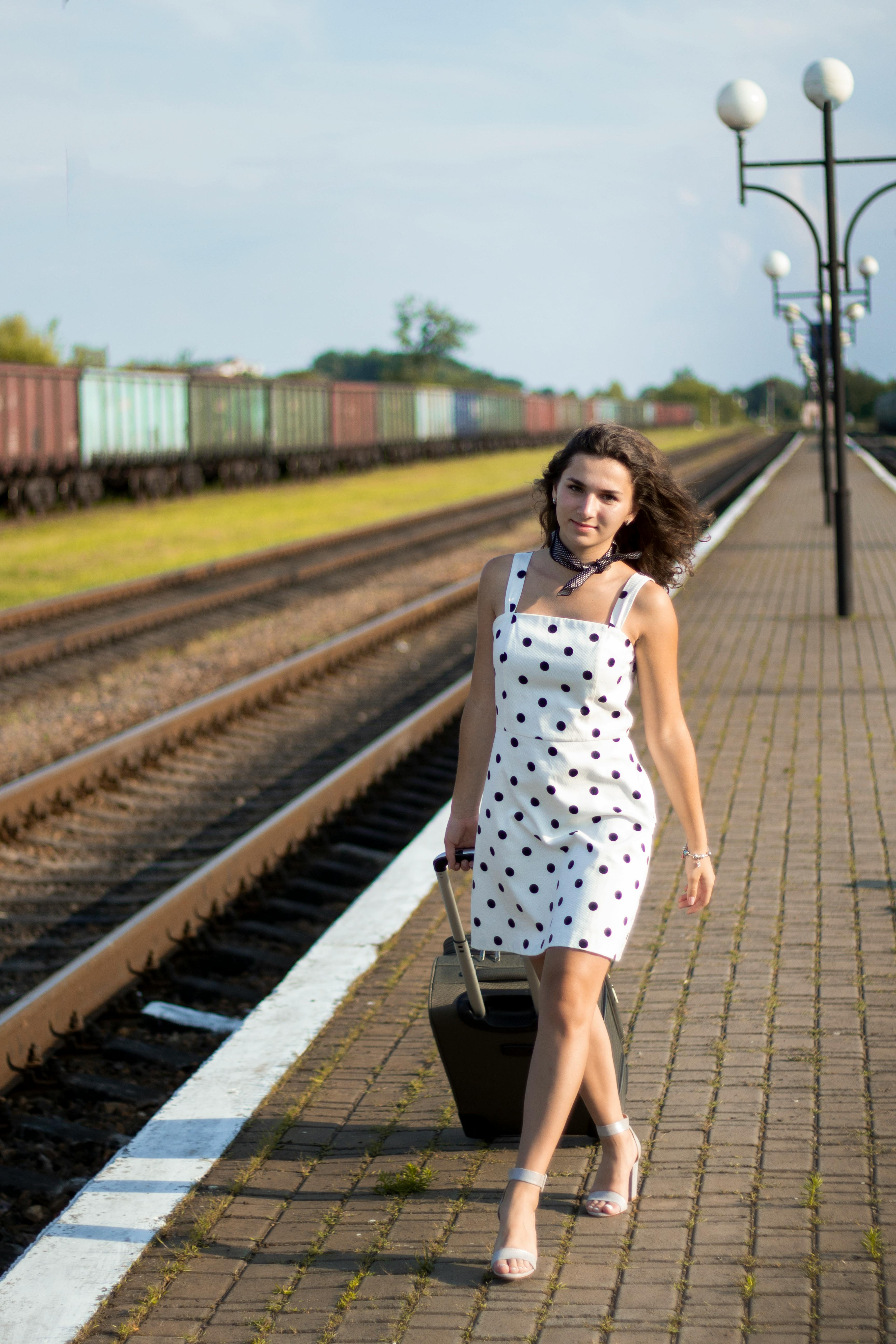 Photo of Woman Standing Near Railroad Track · Free Stock Photo