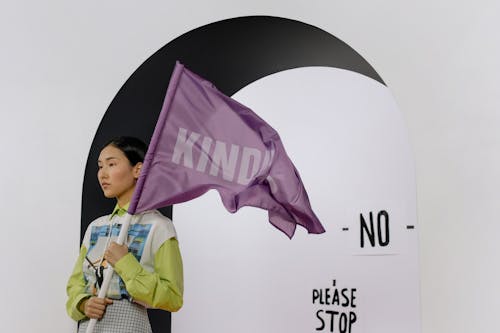 A Girl Holding a Purple Flag