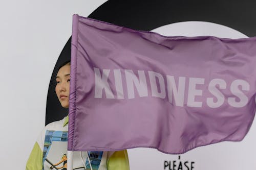 Woman Holding a Purple Flag 