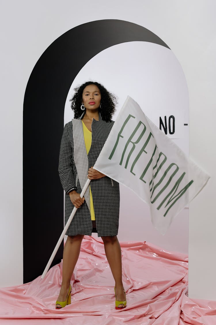 Woman Holding A Freedom Flag