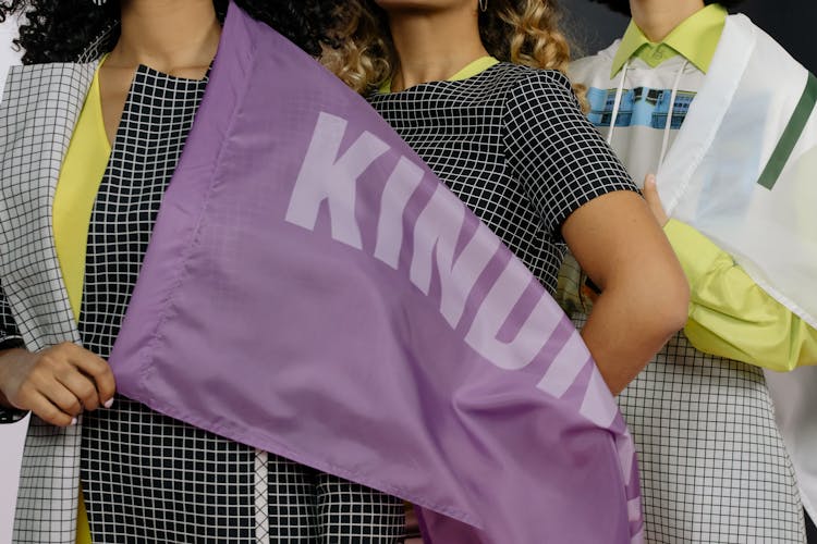 Activists Holding A Purple Banner 