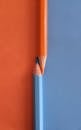 Orange and Blue Pencils on Orange and Blue Surface