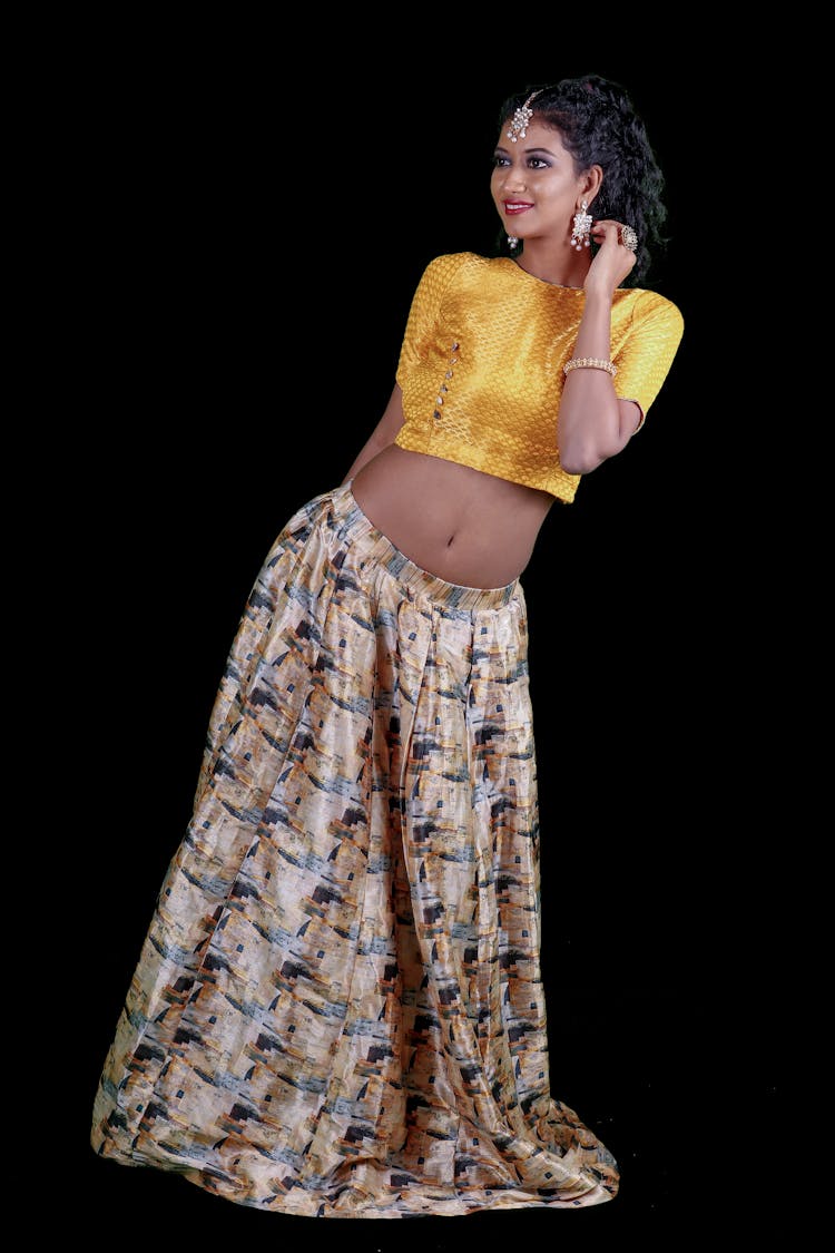 Woman In Yellow Choli Blouse And Lehenga Skirt