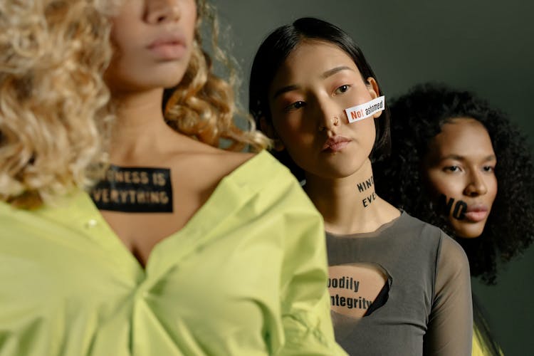 Women Standing Showing Slogan Quotes