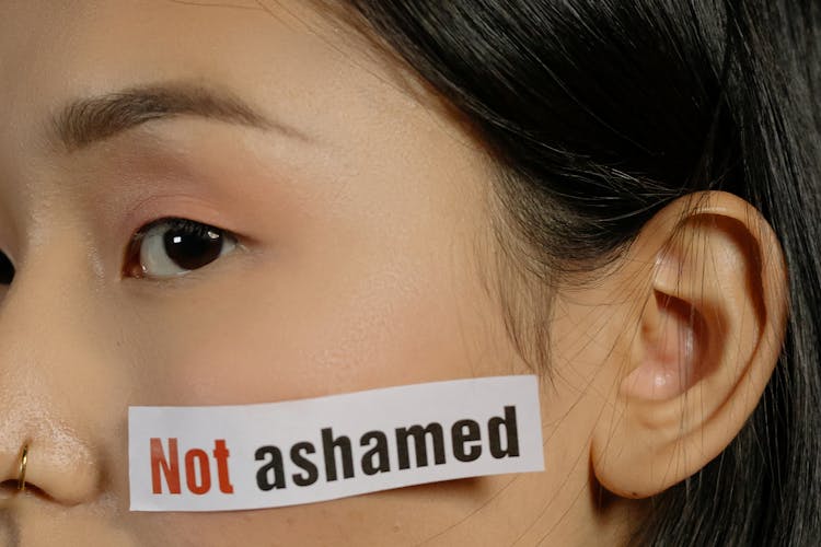 Young Woman With Slogan Quotes On Her Face 