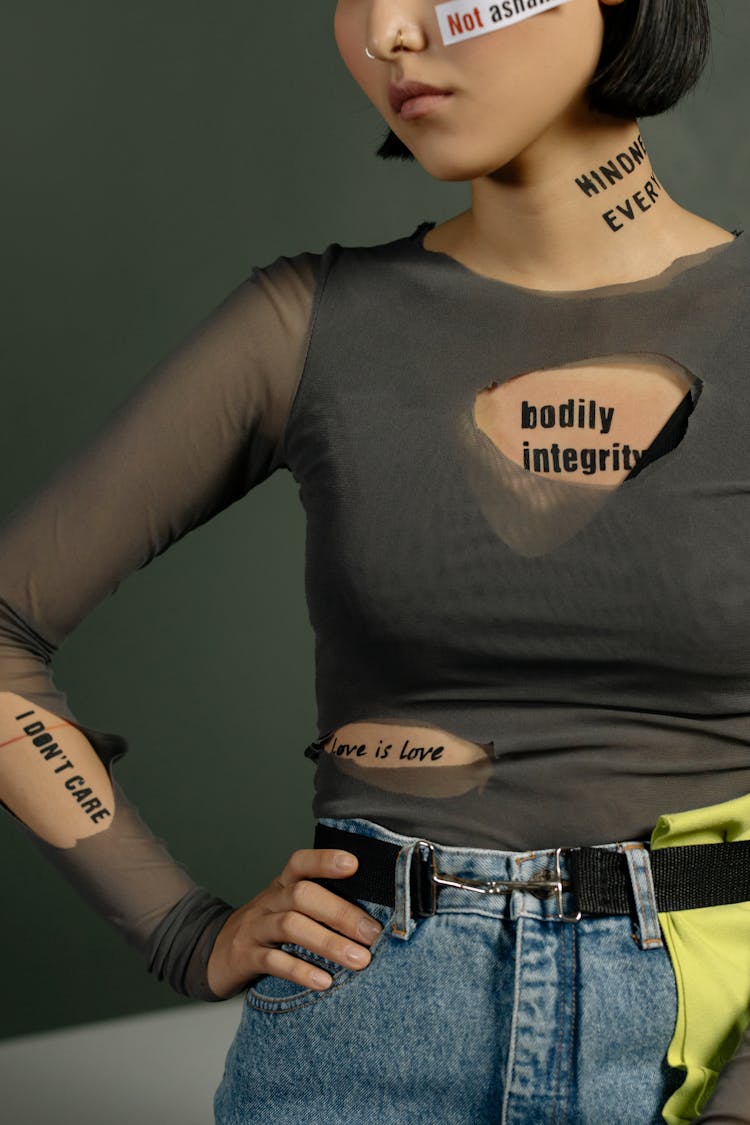 Person Standing With Slogan Quotes On Her Body