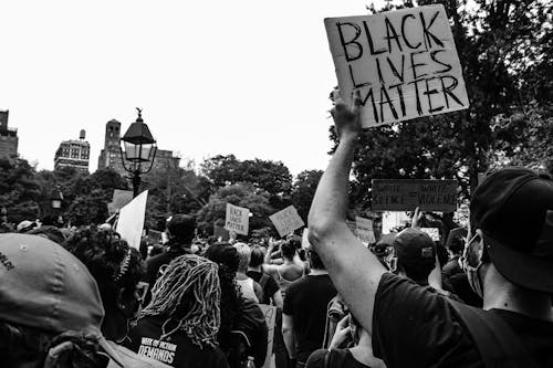 Free Anonymous diverse activists standing on street during Black Lives Matter protests Stock Photo