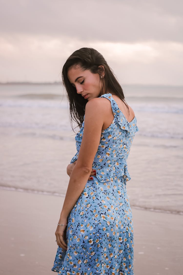 Dreamy Tourist In Sundress On Ocean Beach