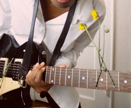 Free Man in White Shirt Holding Electric Guitar Stock Photo