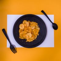Crisp potato chips on a dark plate — Rebbit Visual on Pexels