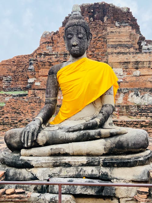 Free Ancient Buddha Statue in Wat Phra Mahathat Temple, in Phra Nakhon Si, Ayutthaya Historical Park, Thailand Stock Photo