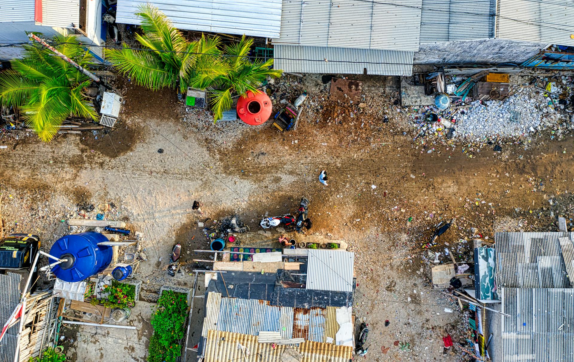 Aerial photograph capturing urban sprawl and debris in Jakarta, Indonesia, highlighting development challenges.