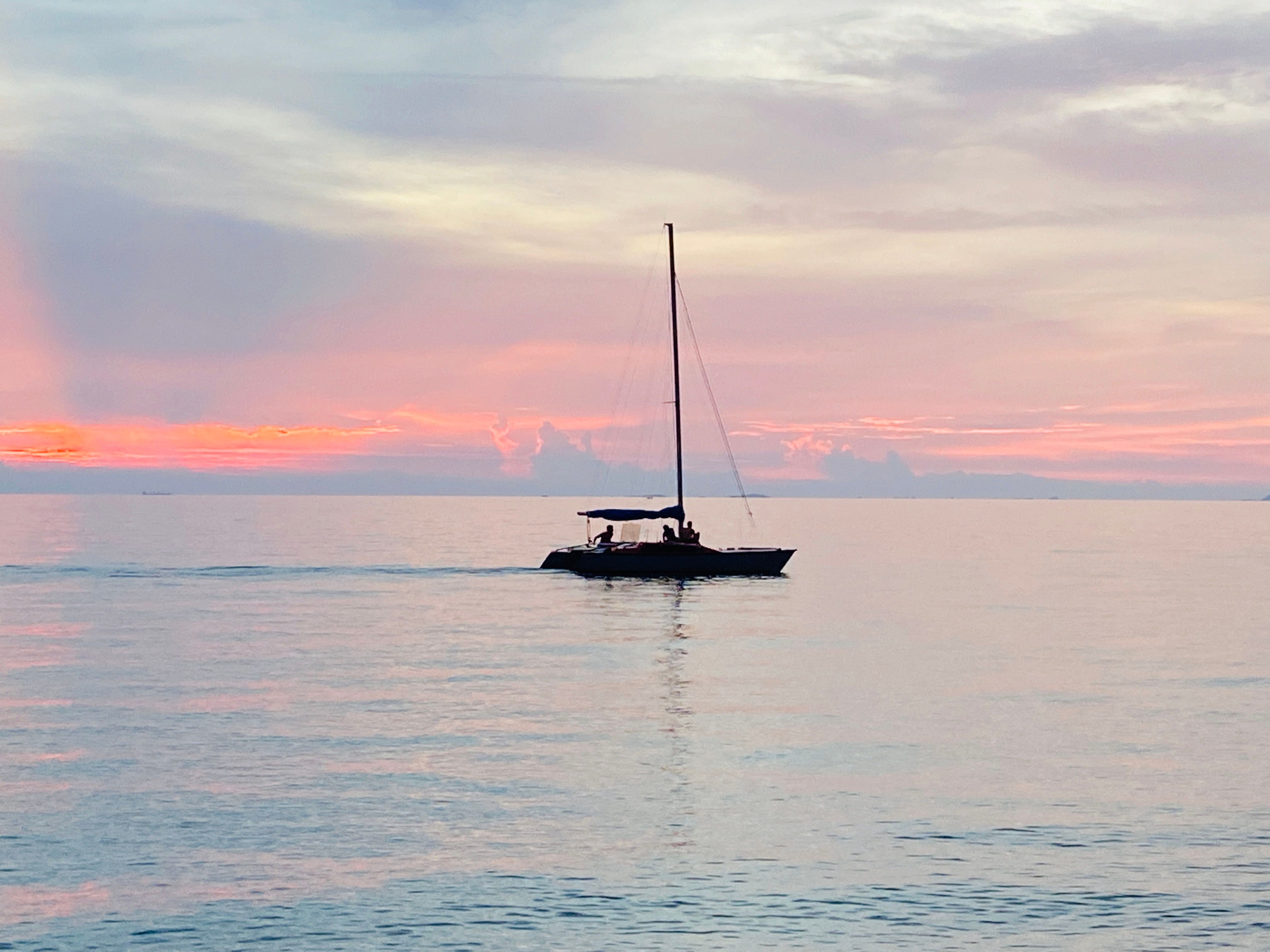 Silhouette of Boat on Sea during Sunset · Free Stock Photo