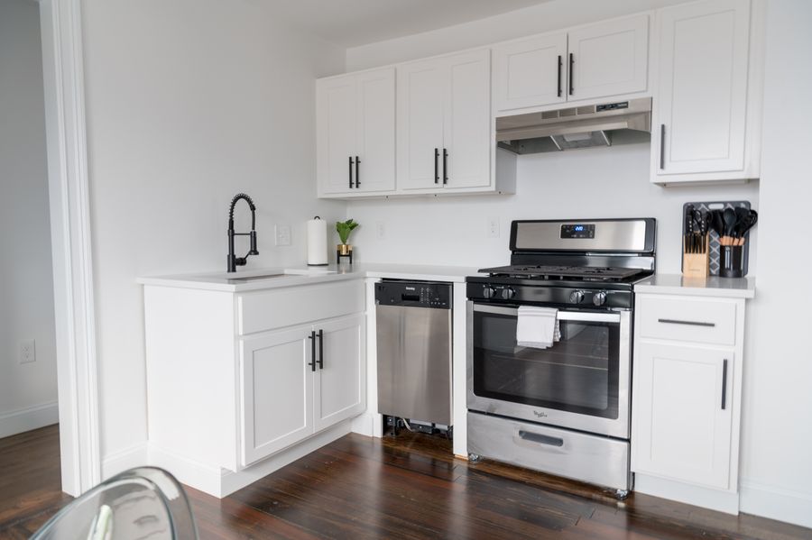Professional-grade stainless range and hood installed during an Irvine Spectrum kitchen remodel