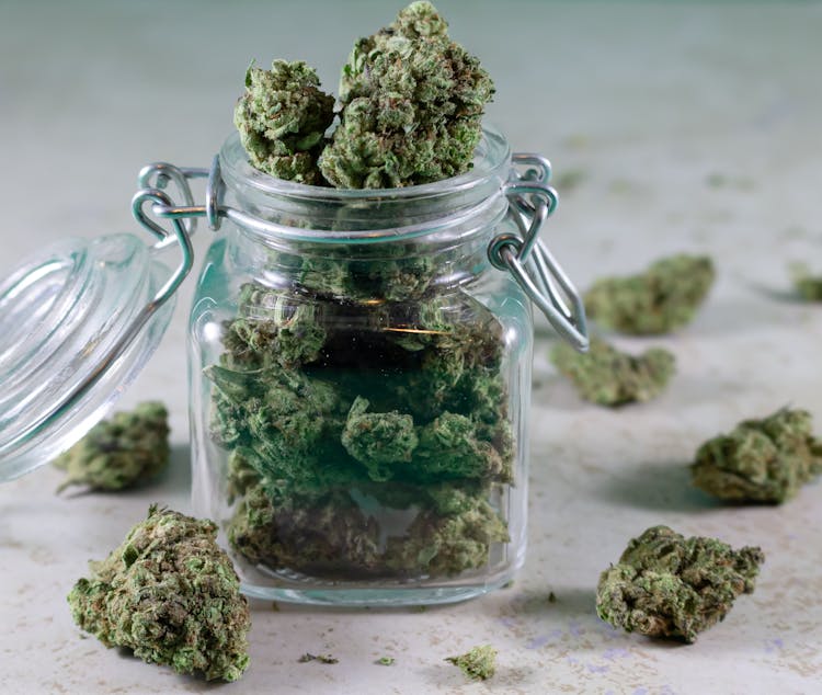 Cannabis In A Glass Jar In Close Up Photography