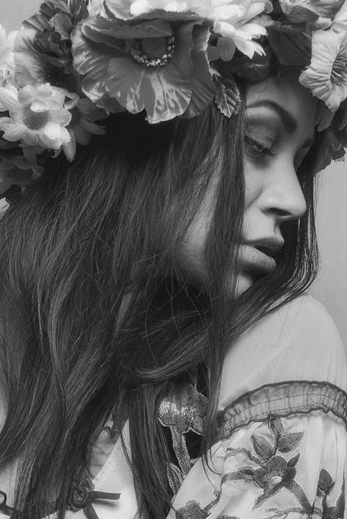 A Grayscale of a Beautiful Woman Wearing a Flower Crown