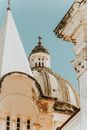 Old church dome with cross and ornamental details in town